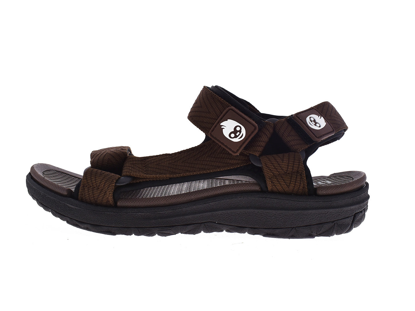 Par de sandalias infantiles estilo gladiator en color marrón con tiras ajustables y suela gruesa.