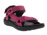 Sandalia para niña color rosa fucsia con suela negra y diseño tipo gladiador.